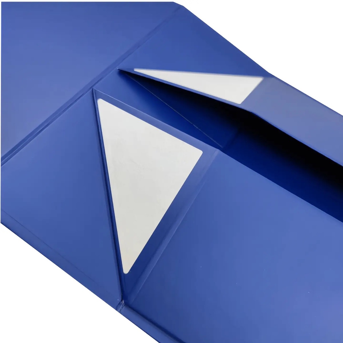 Close view of the reinforced magnetic corner on a blue foldable gift box